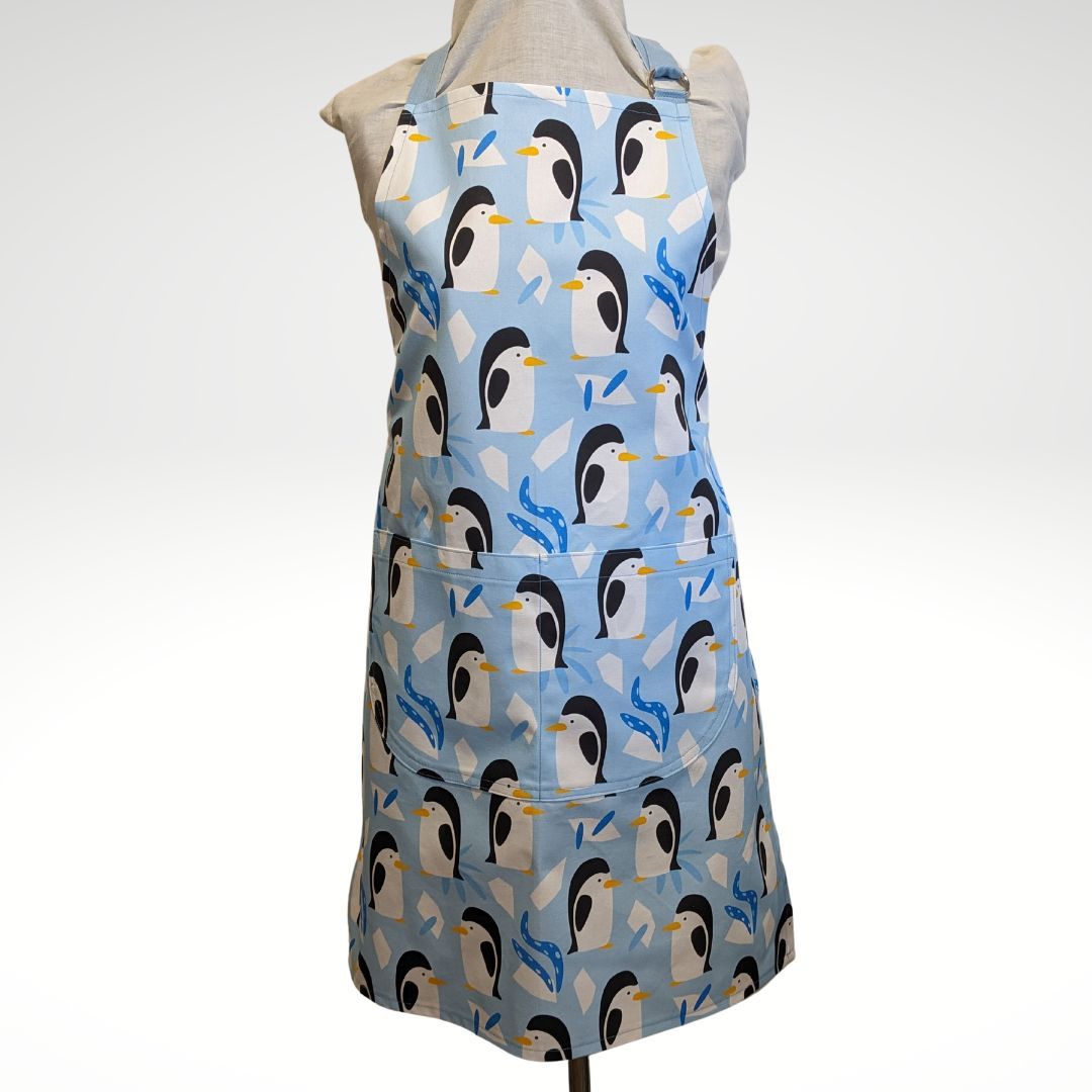 A huddle of penguins apron