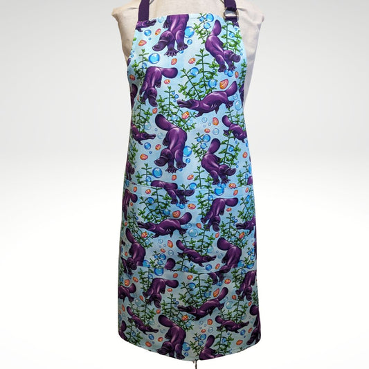 A paddle of purple platypus apron